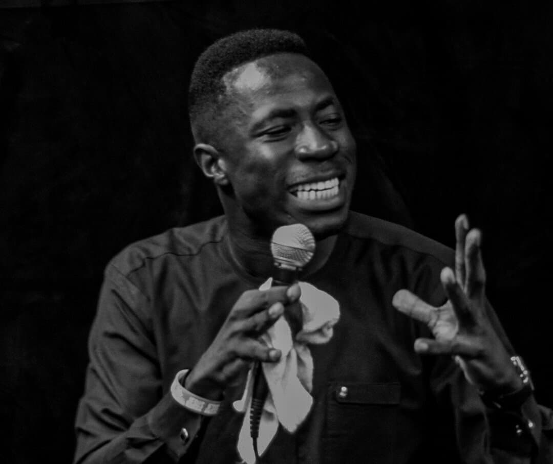 A minister with a microphone at the First Sunday Service
